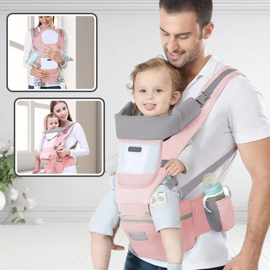 Papa portant son enfant dans un porte bébé rose et ils sont heureux.